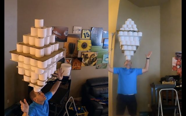 Man Balances 101 Toilet Paper Rolls on His Head for Guinness World Record